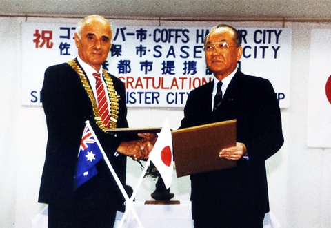 Mr. Bernard F Malouf, mayor of Coffs Harbour and Mr. Kakehashi, Mayor of Sasebo.